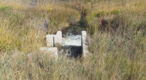 Water from McKinley Ditch going under Highway 50 to Stumpy Creek drainage